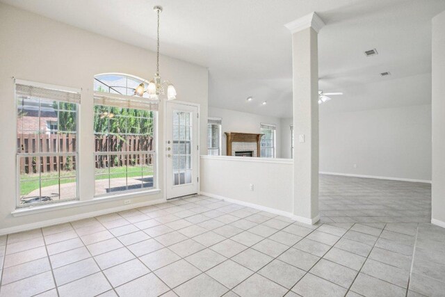 10120 Treasure Island Dr, Austin, TX 78730 - unfurnished dining area featuring light tile patterned floors, a chandelier, baseboards, a ceiling fan, and light colored carpet