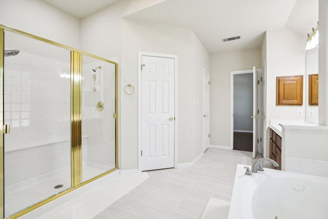 10120 Treasure Island Dr, Austin, TX 78730 - full bath featuring a shower stall, a whirlpool tub, vanity, and baseboards