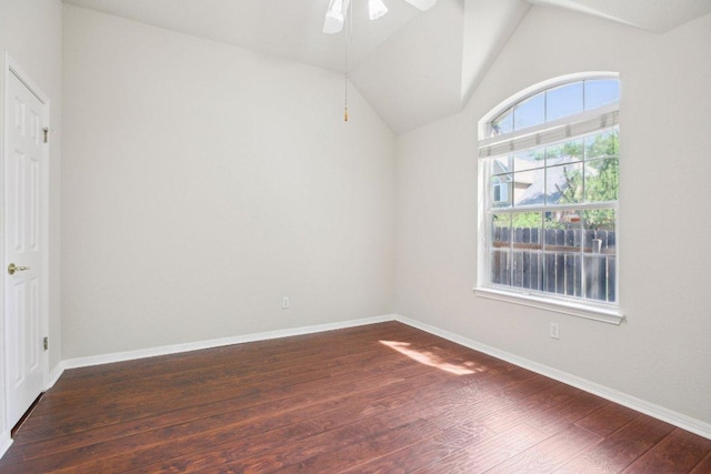 10120 Treasure Island Dr, Austin, TX 78730 - spare room featuring dark wood-style flooring, a ceiling fan, vaulted ceiling, and baseboards