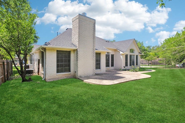 10120 Treasure Island Dr, Austin, TX 78730 - rear view of house with a chimney, roof with shingles, a patio, and brick siding