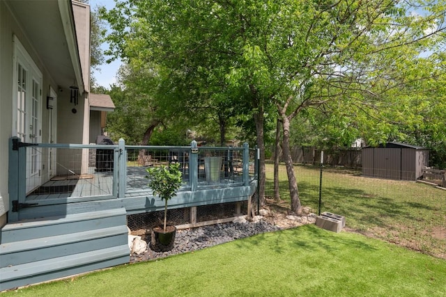12511 Tree Line Dr, Austin, TX 78729 - view of yard featuring a shed, a deck, and an outdoor structure