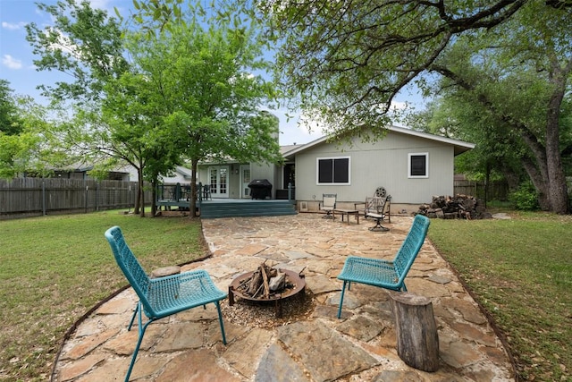 12511 Tree Line Dr, Austin, TX 78729 - rear view of house with a patio and a fire pit