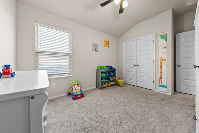 rec room with lofted ceiling, carpet floors, ceiling fan, plenty of natural light, and baseboards