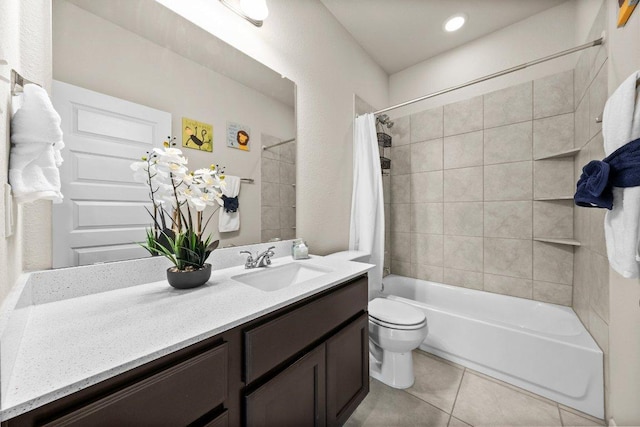 bathroom with tile patterned flooring, shower / bath combo, toilet, and vanity