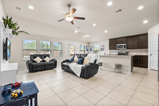21604 Bluejay Blvd, Lago Vista, TX 78645 - living room with vaulted ceiling, a ceiling fan, recessed lighting, and light tile patterned flooring