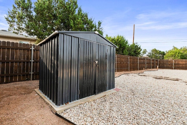 view of shed with a fenced backyard