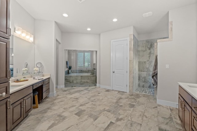 full bathroom with baseboards, two vanities, and a shower stall