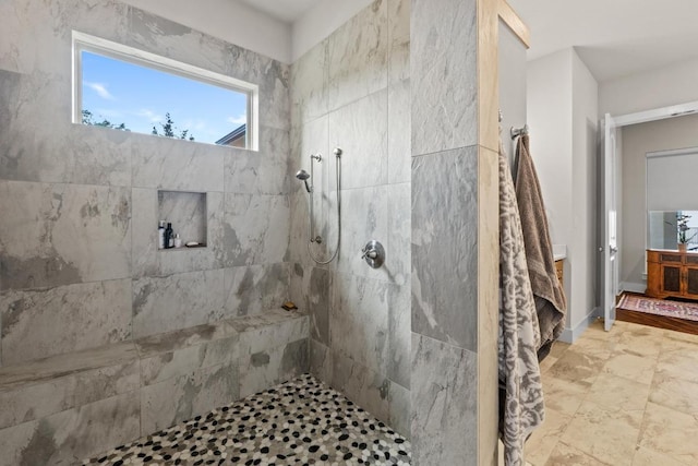 full bathroom featuring a tile shower