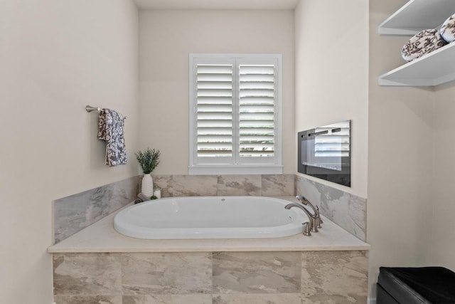 bathroom with a garden tub