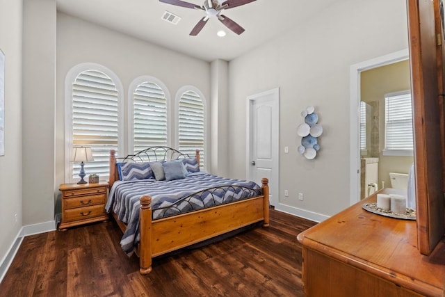 bedroom featuring visible vents, baseboards, ceiling fan, and dark wood-style floors