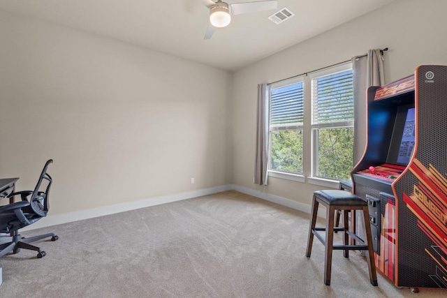 office area featuring visible vents, ceiling fan, baseboards, and carpet flooring