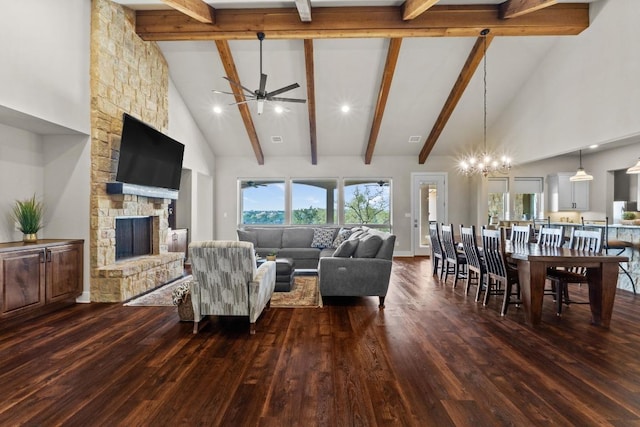 living room featuring dark wood finished floors, high vaulted ceiling, and ceiling fan with notable chandelier