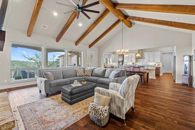 living room featuring dark wood-style floors, visible vents, recessed lighting, ceiling fan with notable chandelier, and high vaulted ceiling