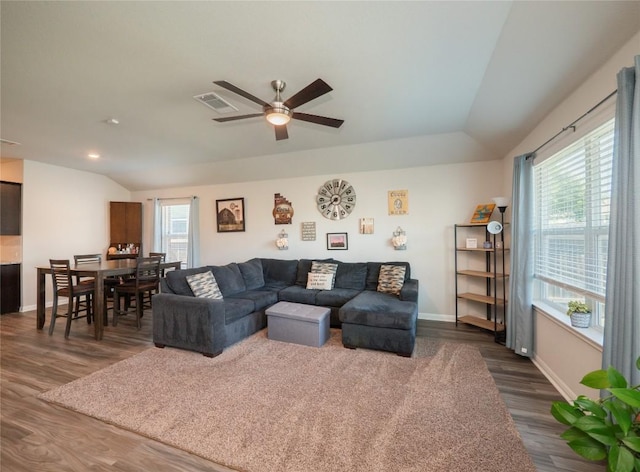 369 Empress Tree Dr, Leander, TX 78641 - living room featuring dark wood-style floors, ceiling fan, baseboards, and lofted ceiling