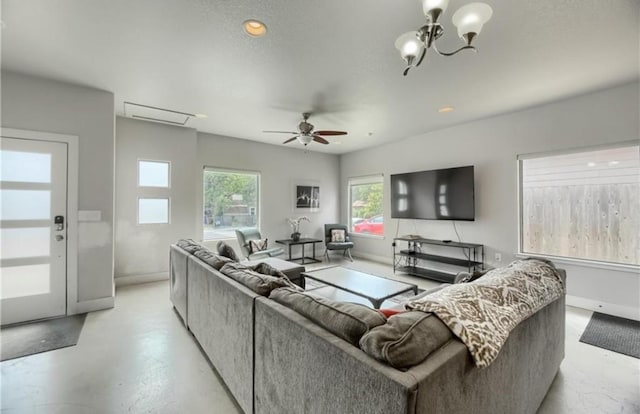 1302 E 3rd St, Austin, TX 78702 - living room featuring finished concrete floors, ceiling fan, and a chandelier