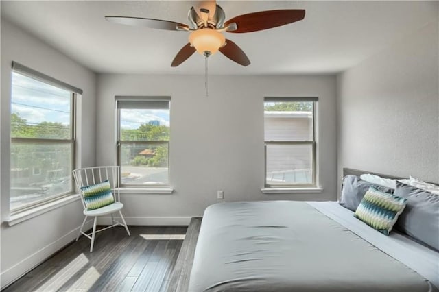 1302 E 3rd St, Austin, TX 78702 - bedroom featuring wood finished floors and a ceiling fan