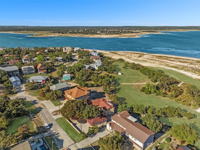 drone / aerial view featuring a residential view and a water view