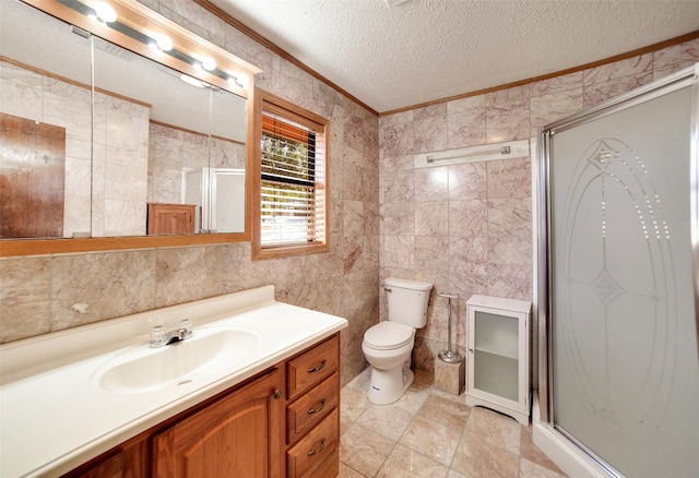 full bathroom featuring toilet, vanity, crown molding, a textured ceiling, and a stall shower