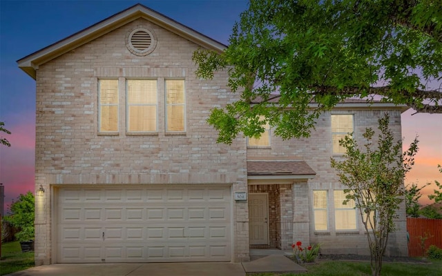 504 Dark Tree Ln, Round Rock, TX 78664 - view of front facade with driveway, an attached garage, and brick siding