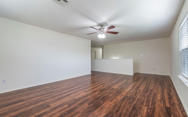 504 Dark Tree Ln, Round Rock, TX 78664 - spare room with dark wood-style floors and a ceiling fan
