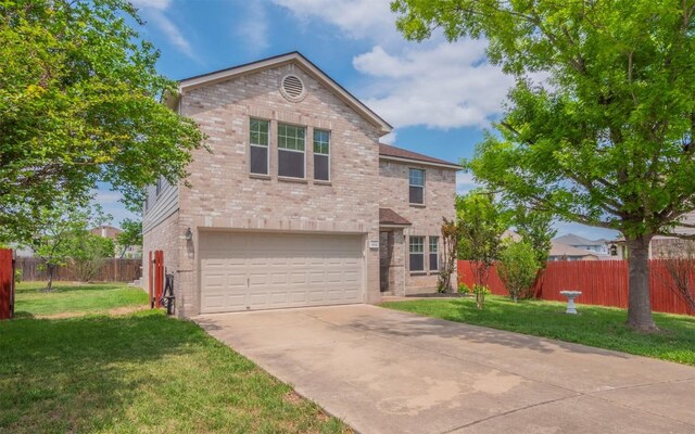 504 Dark Tree Ln, Round Rock, TX 78664 - traditional-style home with an attached garage, brick siding, and concrete driveway
