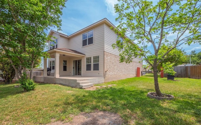 504 Dark Tree Ln, Round Rock, TX 78664 - back of house with brick siding and a patio area
