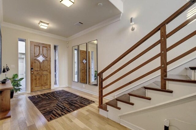 1621 Enfield Rd Unit B, Austin, TX 78703 - foyer with stairway, light wood-style floors, crown molding, and plenty of natural light