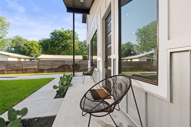 view of patio featuring fence