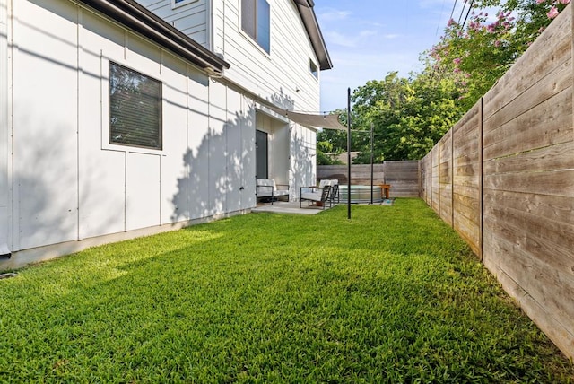 view of yard with a fenced backyard and a patio area