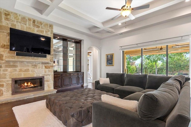 205 Bisset Ct, Austin, TX 78738 - living room featuring coffered ceiling, beamed ceiling, wood finished floors, arched walkways, and ceiling fan