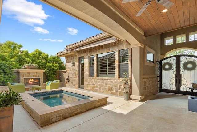 205 Bisset Ct, Austin, TX 78738 - foyer entrance with wood ceiling, french doors, and a ceiling fan