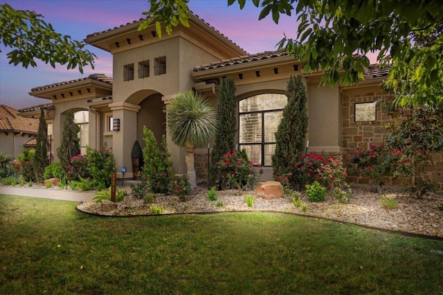 205 Bisset Ct, Austin, TX 78738 - mediterranean / spanish home with stucco siding, a lawn, and stone siding