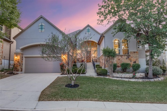 29047 Hobblebush, San Antonio, TX 78260 - view of front of property with stucco siding, a front lawn, concrete driveway, and stone siding