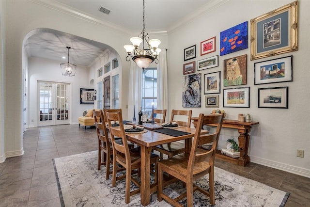 29047 Hobblebush, San Antonio, TX 78260 - tiled dining area featuring arched walkways, healthy amount of natural light, a chandelier, and ornamental molding