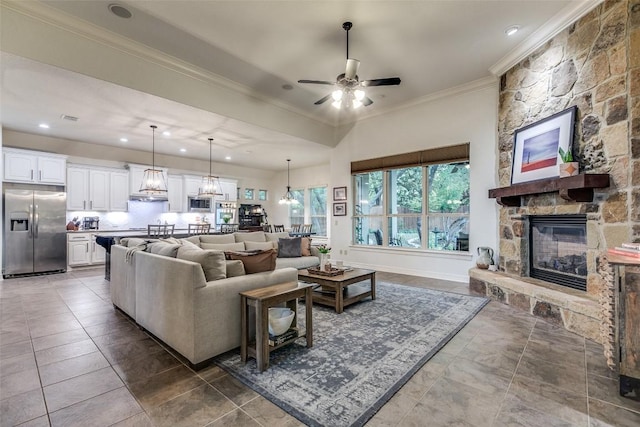29047 Hobblebush, San Antonio, TX 78260 - living area with ornamental molding, a stone fireplace, ceiling fan, recessed lighting, and tile patterned floors