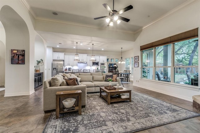 29047 Hobblebush, San Antonio, TX 78260 - living area with ceiling fan, arched walkways, ornamental molding, and a chandelier