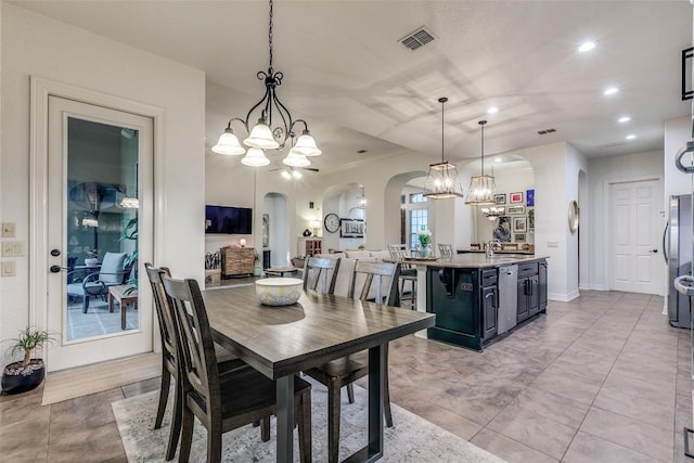 29047 Hobblebush, San Antonio, TX 78260 - dining room featuring arched walkways, a chandelier, and recessed lighting