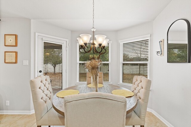 19000 Obed River Dr, Pflugerville, TX 78660 - dining room featuring a chandelier and light tile patterned flooring