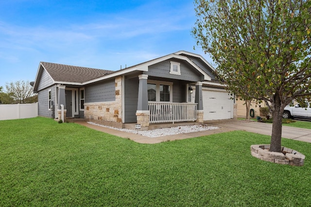 19000 Obed River Dr, Pflugerville, TX 78660 - view of front of house with a front lawn, a porch, stone siding, concrete driveway, and fence