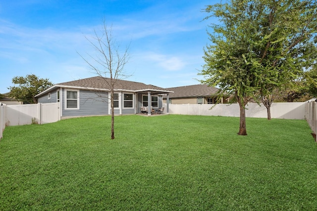 19000 Obed River Dr, Pflugerville, TX 78660 - rear view of house featuring a yard and a fenced backyard