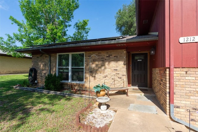 1212 Lake Terrace Dr, Elgin, TX 78621 - view of exterior entry featuring brick siding