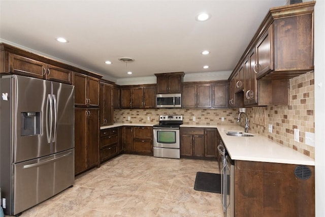 1212 Lake Terrace Dr, Elgin, TX 78621 - kitchen featuring a sink, dark brown cabinetry, light countertops, appliances with stainless steel finishes, and visible vents
