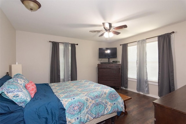 1212 Lake Terrace Dr, Elgin, TX 78621 - bedroom with a ceiling fan, baseboards, and dark wood-type flooring