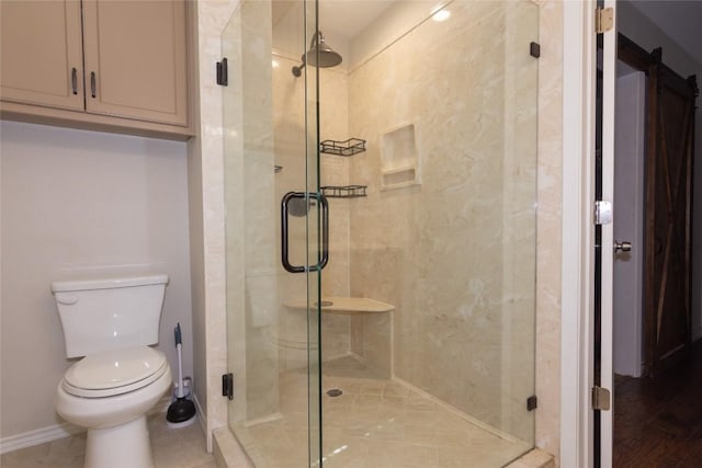 1212 Lake Terrace Dr, Elgin, TX 78621 - bathroom featuring baseboards, toilet, and a stall shower
