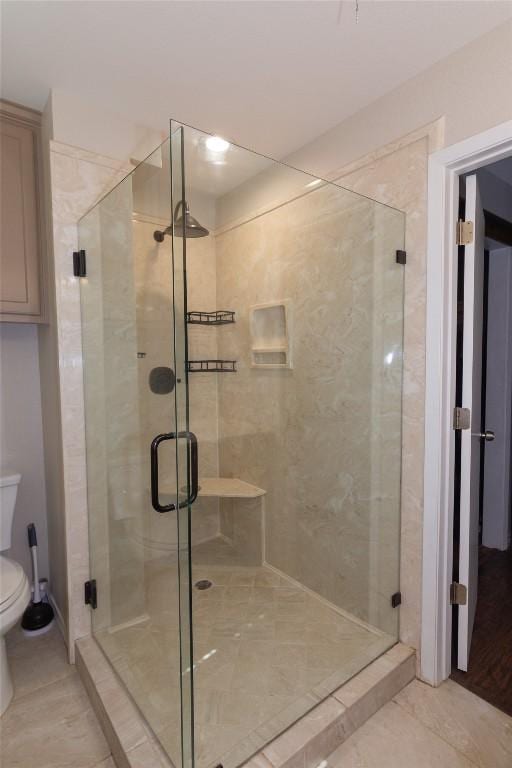 1212 Lake Terrace Dr, Elgin, TX 78621 - bathroom featuring tile patterned flooring, a shower stall, and toilet
