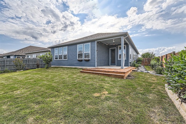 9945 Comely Bnd, Manor, TX 78653 - back of property featuring a wooden deck