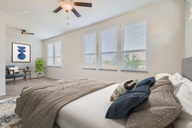 9945 Comely Bnd, Manor, TX 78653 - carpeted bedroom with baseboards and a ceiling fan