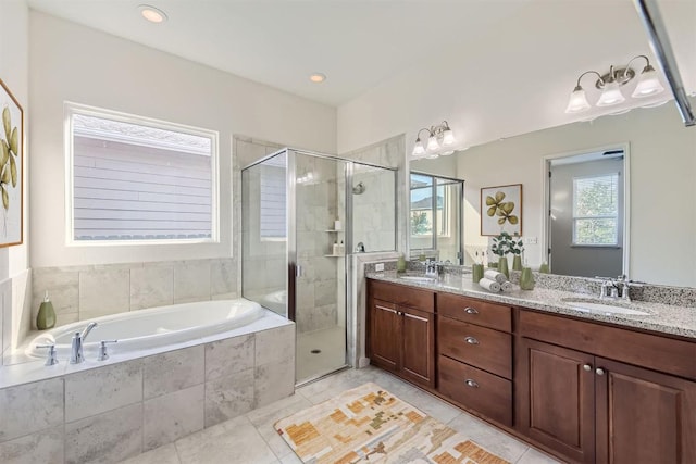 9945 Comely Bnd, Manor, TX 78653 - full bathroom with a garden tub, double vanity, a stall shower, tile patterned floors, and recessed lighting