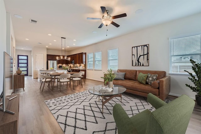 9945 Comely Bnd, Manor, TX 78653 - living area featuring a ceiling fan, recessed lighting, baseboards, and light wood-style flooring