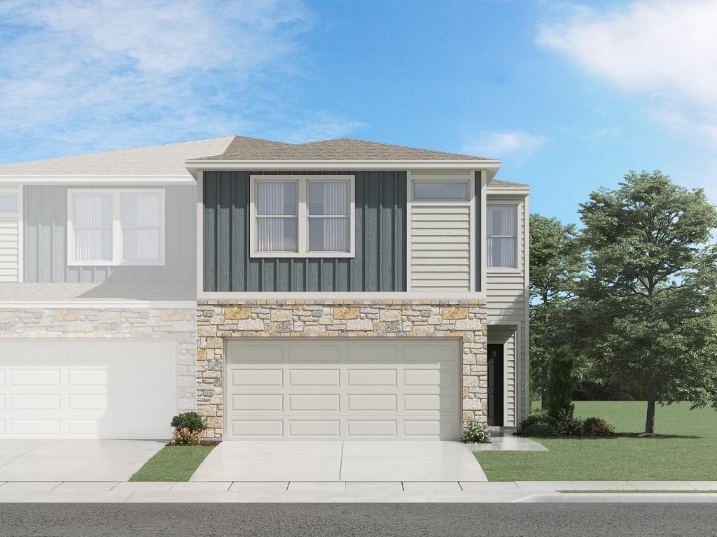 1850 Settlers Glen Dr Unit 1301, Round Rock, TX 78665 - view of front of home with a front lawn, board and batten siding, an attached garage, driveway, and stone siding